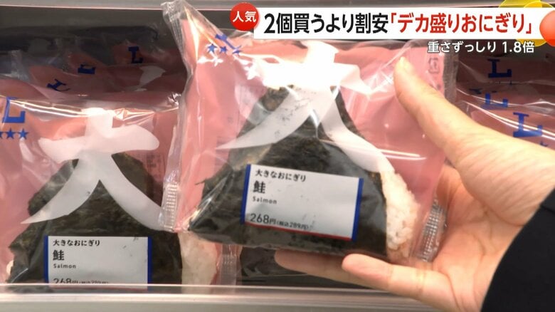 「手に持ってみると、かなりずっしりしています。」と話す取材班