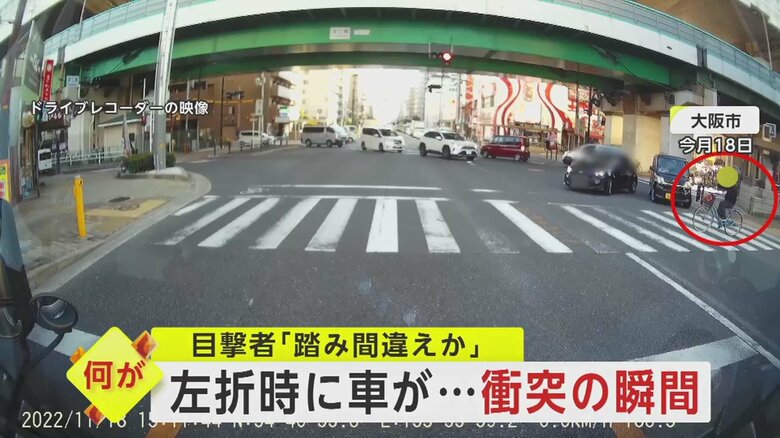 横断歩道を1台の自転車が渡り始める