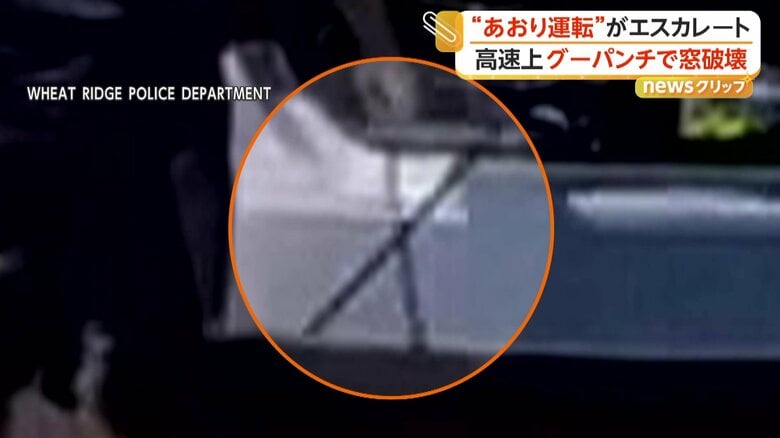 工具のようなものを手にした片方の運転手