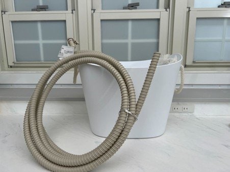 温水機能がなくてもお風呂からお湯取りホースで給水すれば温水で洗える（提供：平島利恵さん）