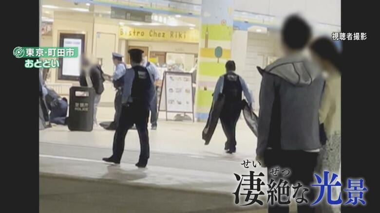 飲食店エリアから外に出る辺りに、血まみれの男性が倒れていたという