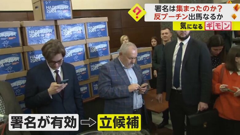 署名の入った箱が積み上げられている
