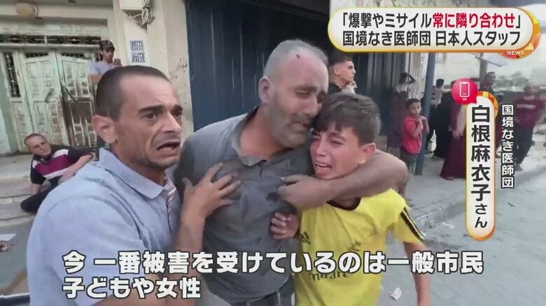 抱き合う男性と子ども