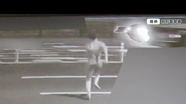 車が行き交う幹線道路を、走って渡る八田容疑者