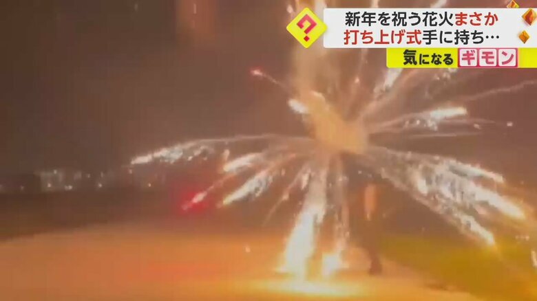 打ち上げ花火が男性の手の中で爆発する瞬間④