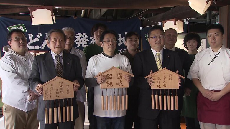 写真中央の人が吉田尚人会長