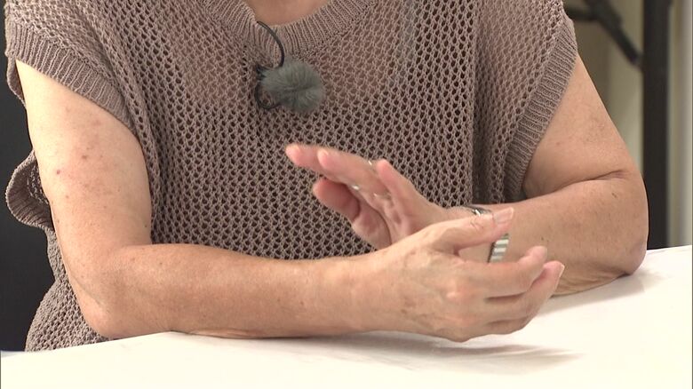 詐欺を見破った女性