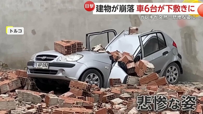 ガレキに押しつぶされた車（IHA）