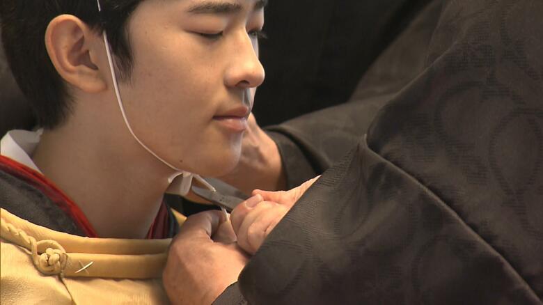 掛緒が切り落とされる