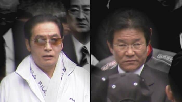 野村被告と田上不美夫被告（69）