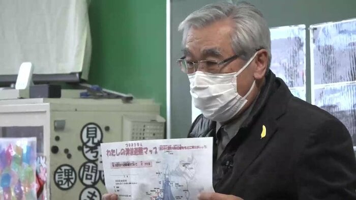 小学生に震災の教訓を伝える田中さん