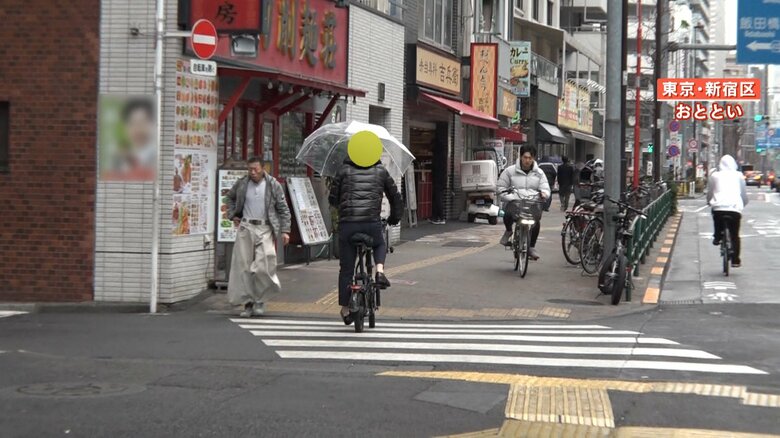 傘を差したまま走行