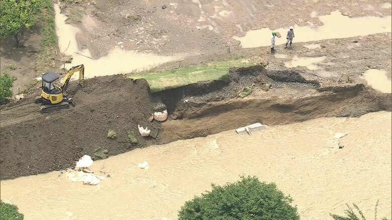 堤防が決壊した敷地川
