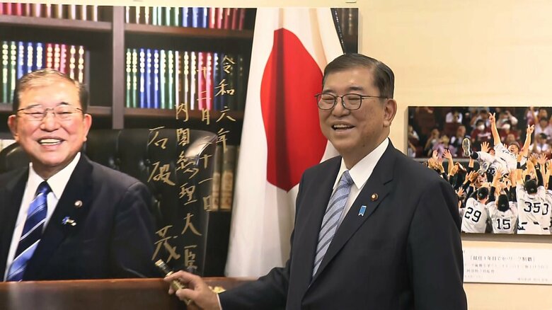 報道写真展では満面の笑み　2024年12月