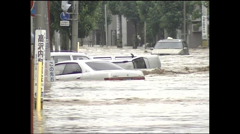 足羽川の決壊で市街地が濁流にのみ込まれた福井豪雨