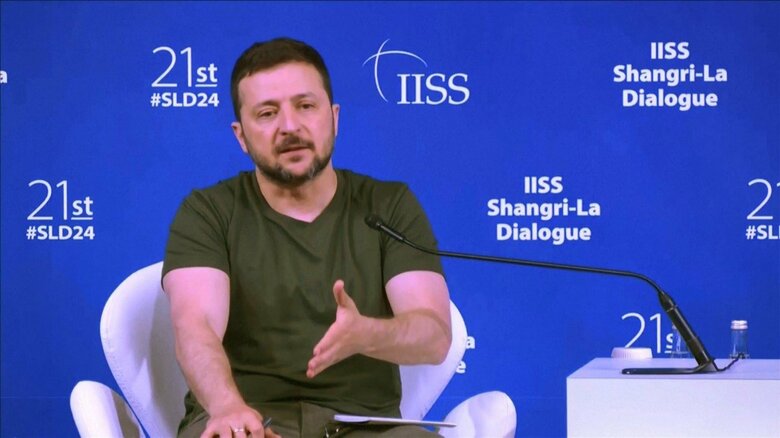 記者会見で異例の中国批判