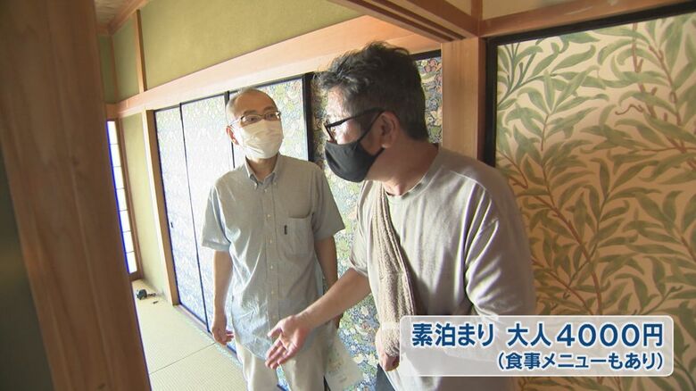 客を案内する司さん