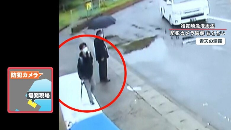 車列が向かった方向を見つめる木村容疑者