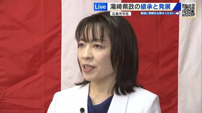 広島市中区の選挙事務所でインタビューに答える横田氏