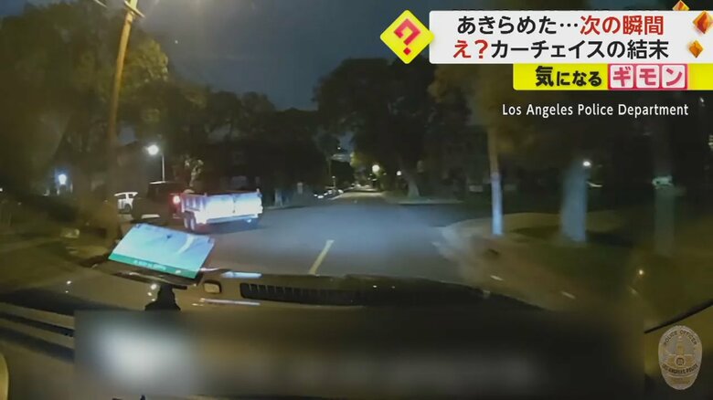 交差点を曲がり逃げるトラック