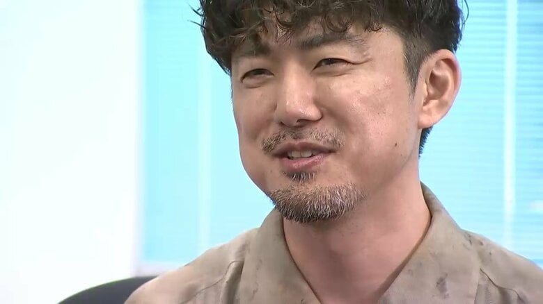 佐々木国允会長の言葉に笑顔の富川さん