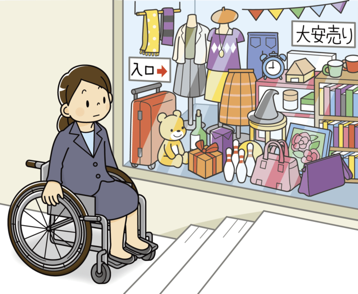 階段の前に車いすの女性が佇んでいる (C)障害平等研修フォーラム