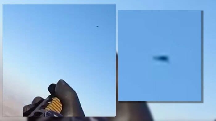  後部座席窓を開いて銃を構えロシアの自爆ドローンに狙いをつける様子（ウクライナ第11陸軍航空旅団　公式Facebookより）