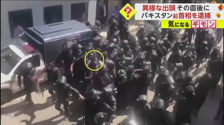 治安部隊に取り込まれるカーン氏