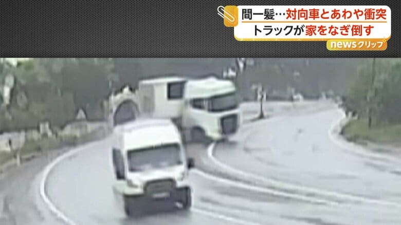カーブで横滑りし始めるトラック（IHA）