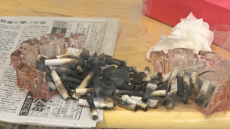 灰皿が割れ、吸い殻が落下