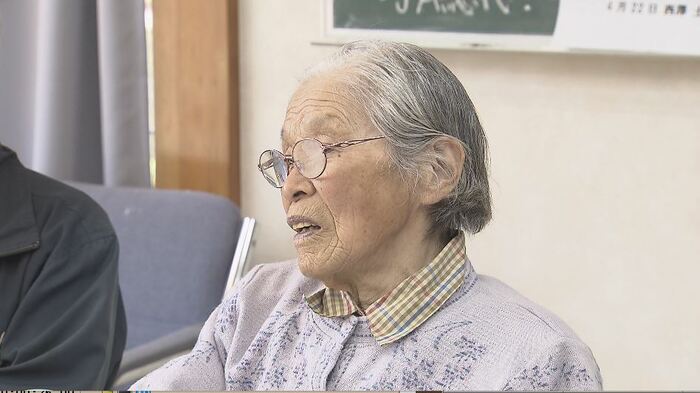 証言する田中さん