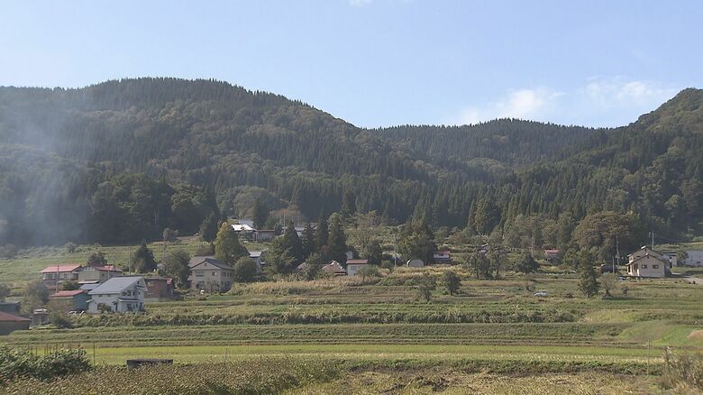 現場は集落から少し離れた山林