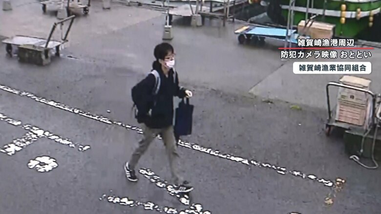 黒い手提げのような物を持っている木村容疑者