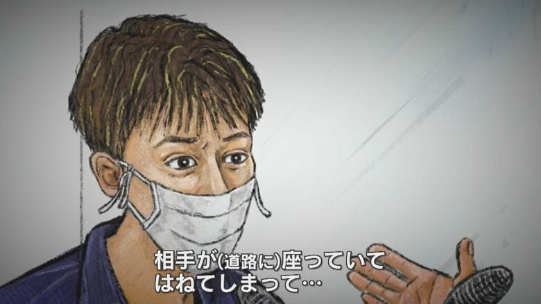 拘置所で取材に応じる由井被告