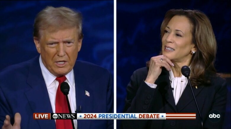 討論会での2人の表情