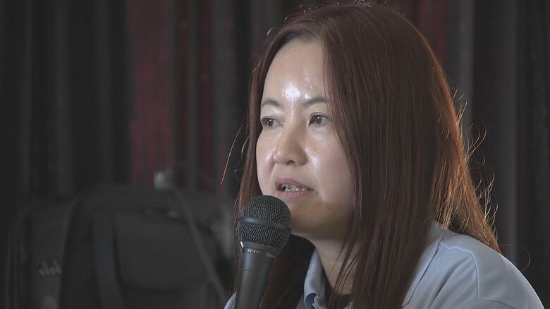 研修で講話をする佐藤さん