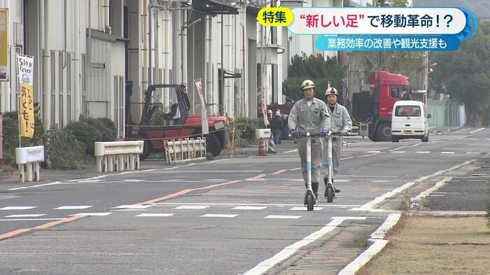 電動キックボードで敷地内を移動する従業員