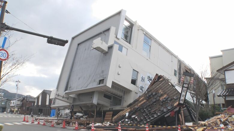 自宅兼店舗は7階建てのビルに押しつぶされる