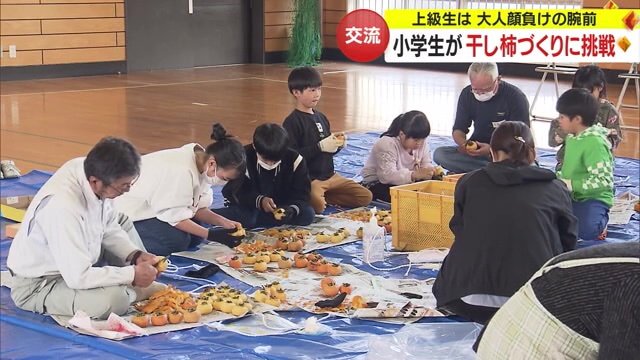 おじいちゃんおばあちゃんたちと一緒に一生懸命取り組む児童たち