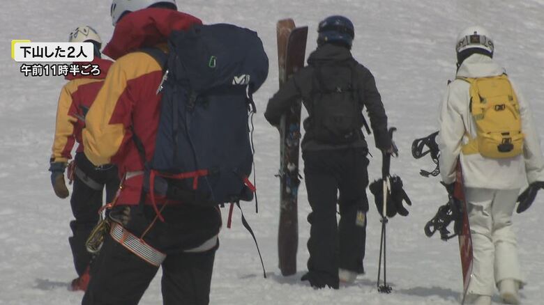 救助された2人と救助隊員