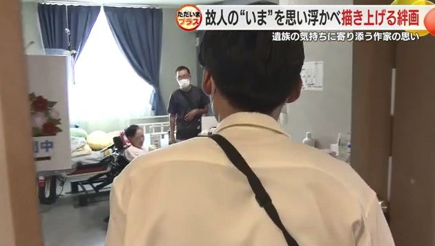 作品を届ける大村さん