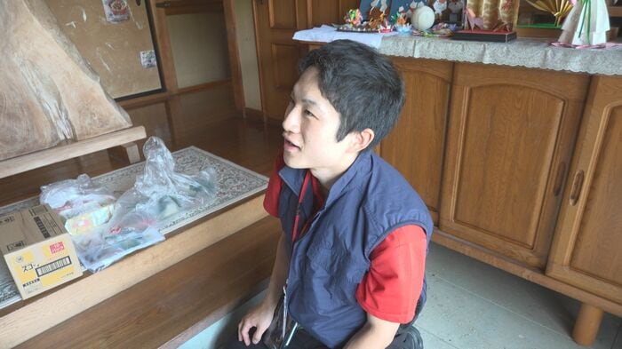 組合員に声を掛ける配送リーダーの溝口さん