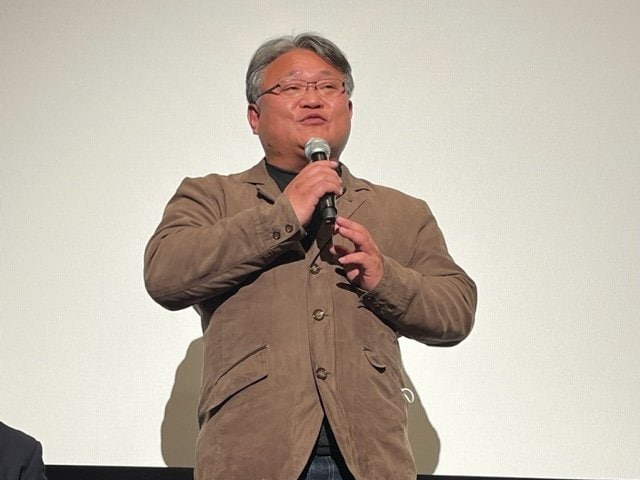 「生きる」で舞台挨拶をする只野英昭氏(筆者撮影)。記録した映像は千ギガバイトに及んだ
