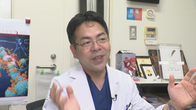 小野賢二郎教授