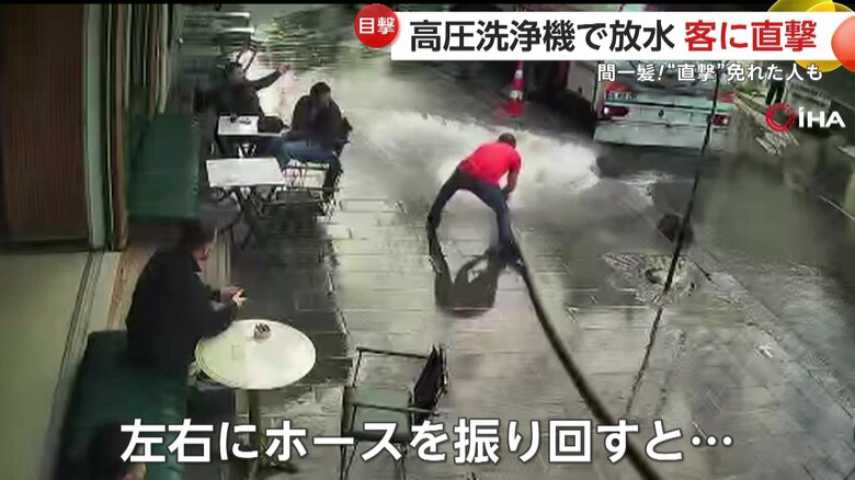 ホースを振り回す店主