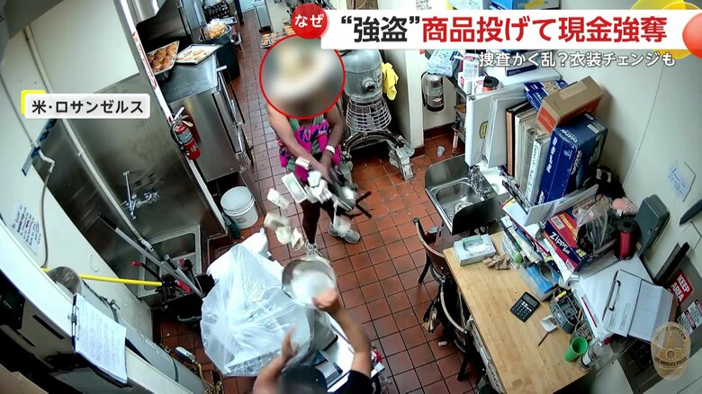 事務所に侵入し店員に銃を向ける強盗