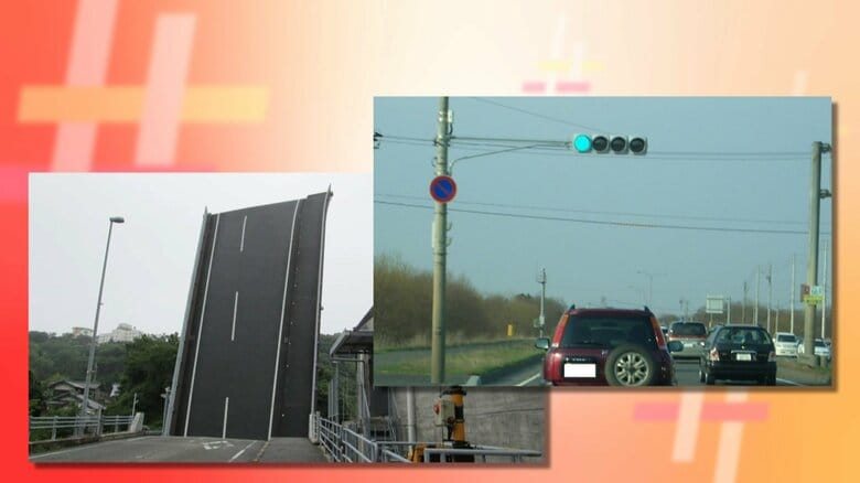 そびえたつ道路に、ライトが4つの信号機