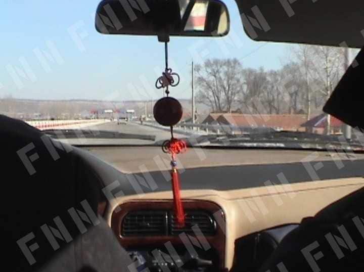 車で延吉郊外に向かう　行き先不明