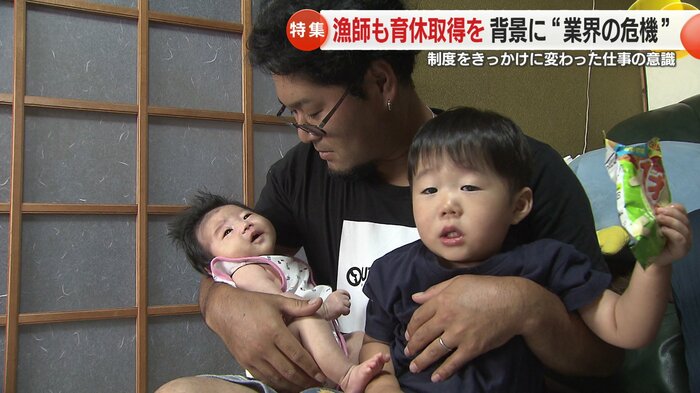 両腕に愛する子供を抱き、気持ちを新たにする白水さん