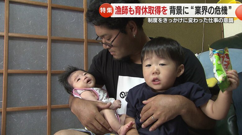 両腕に愛する子供を抱き、気持ちを新たにする白水さん